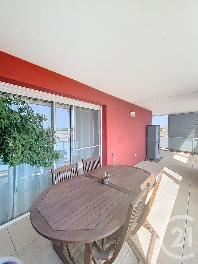 Afficher la photo en grand Appartement F3 à vendre - 3 pièces - 56.6 m2 - MAUGUIO CARNON - 34 - LANGUEDOC-ROUSSILLON - Century 21 Agence Soleil